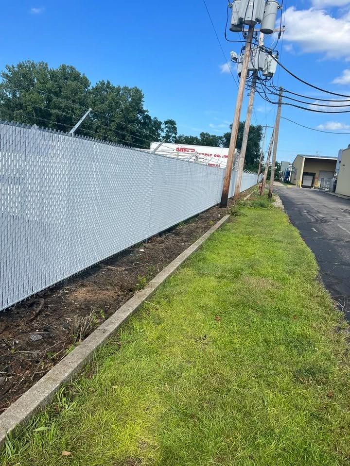 White chain link fence with privacy slats