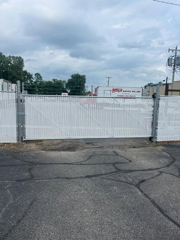 White chain link gate with privacy slats